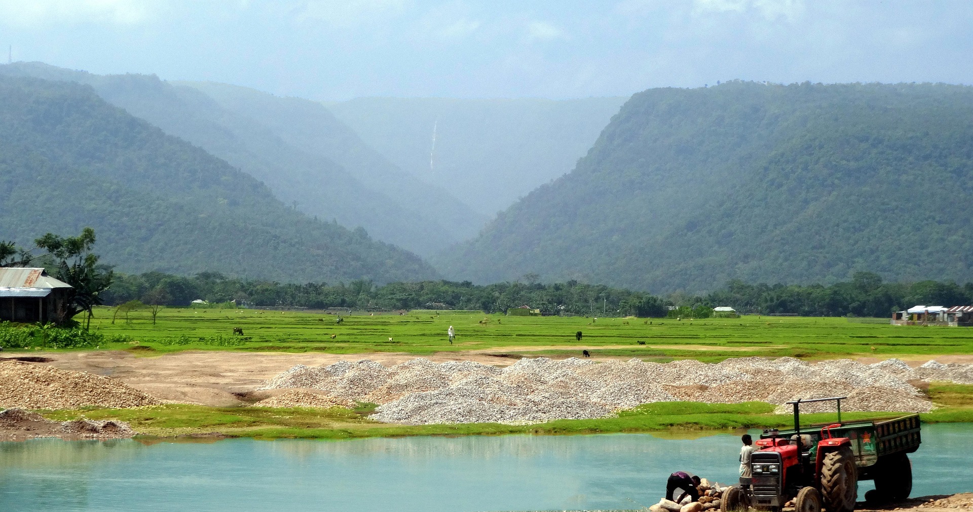 Sylhet Valley Landscape Sylhet valley with green fields, hills, and small village houses
